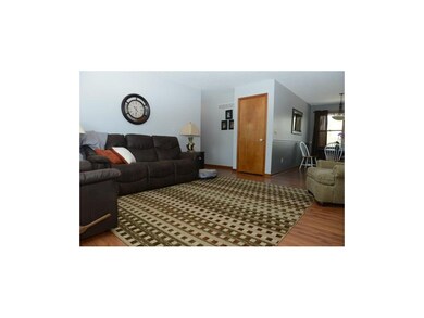 Spacious living room with laminate floors.