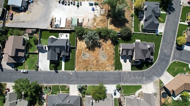 Aerial overview of property's location featuring nearby suburban area