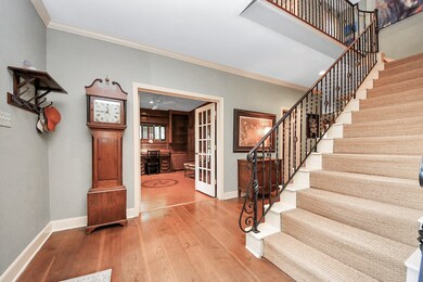 A third view of the entry reveals crown molding, t