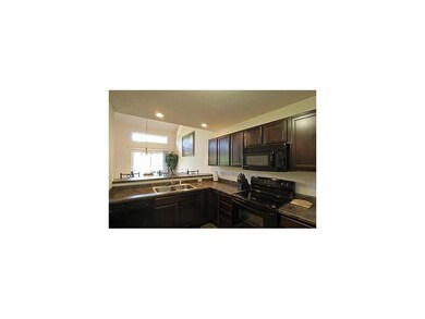 Kitchen. Espresso maple kitchen cabinetry.