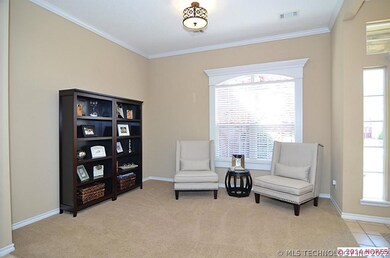 Another view of the formal living area, chandelier
