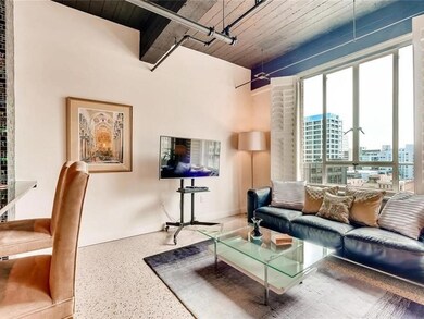 Living area featuring speckle patterned floor and