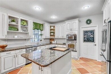 Chef's Kitchen with access to Laundry Room and Gar