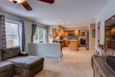 Kitchen opposite family room, amply lit by natural