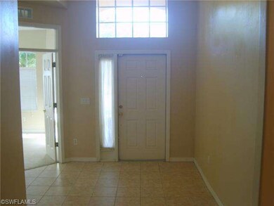 LARGE FOYER AREA, DEN WITH FRENCH DOORS IS LOCATED