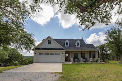 View of front of property featuring stone siding,