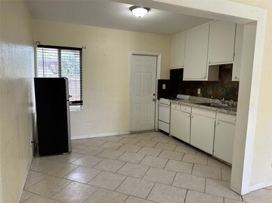 Kitchen with door to the private backyard.