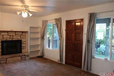 Living Room with fireplace and skylight