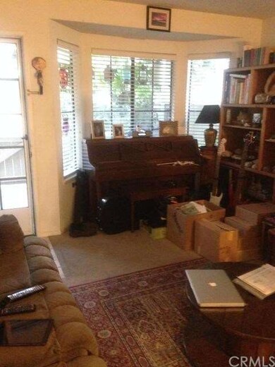 Huge bay window lets lots of light in living room.