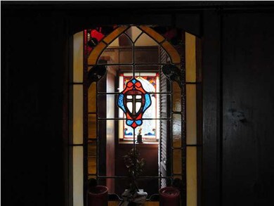 Vintage stained glass windows flank the chapel.