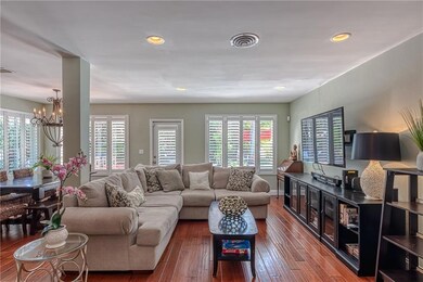 Large living area with plantation shutters and hi-