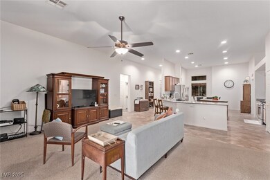 Living area featuring a ceiling fan, recessed ligh