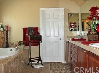 master bathroom with a huge walk in closet, double sinks for him and her