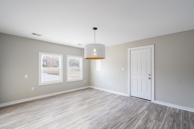 This room is right off of the kitchen and is a very generously sized dining room. 