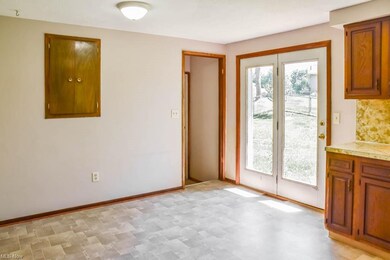 Dinette with a deep built-in cabinet and backyard 