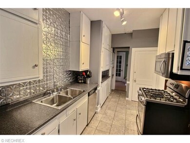 Large kitchen with detailed back-splash and plenty