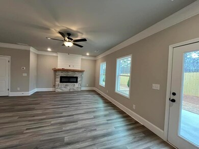 Unfurnished living room with wood finished floors,