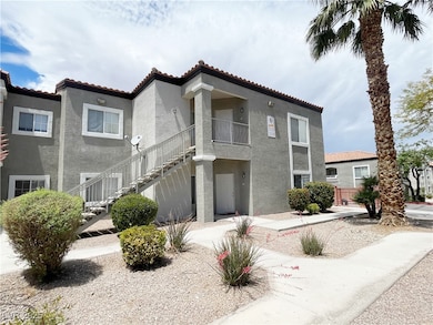 View of front of home featuring stucco siding, a t