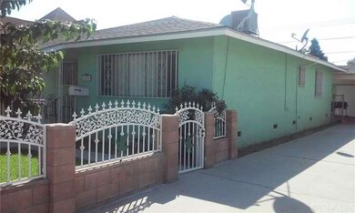 Block wall and gate that leads to the front door. 