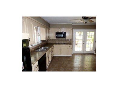 New french doors lead to patio