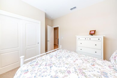 Guest bedroom with a nice size closet.