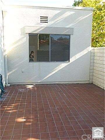 Front enclosed patio with tiled floors