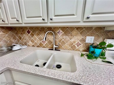 Kitchen with solid surface countertops and stone t