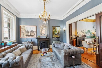Living room/ parlor with marble fireplace