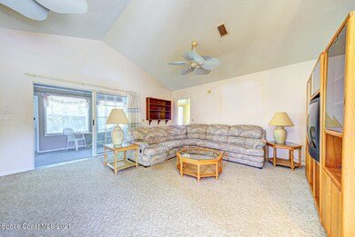 living room with sliders to back porch