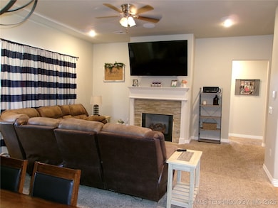 LIVING AREA LOOKING TO HALL WITH THE 3 BEDROOMS OF