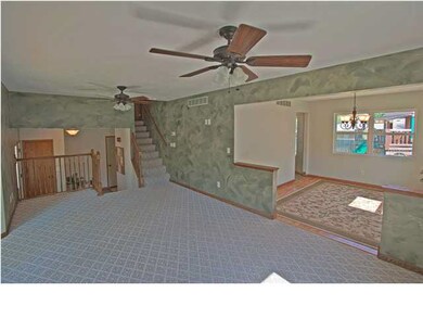 VIEW OF LIVING! DINING AND STAIRS TO BEDROOMS