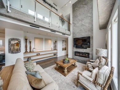Living room is adorned with a 20 ft. neolith firep