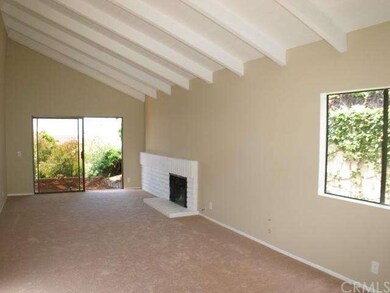 Cozy Fireplace in Open Beamed Living Room & Dining