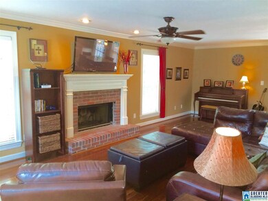 With a brick fireplace and lots of windows for nat