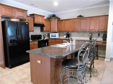 Spacious kitchen with island and desk area
