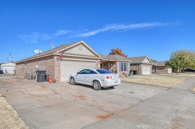 view of the front of the home with extra parking a