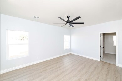Unfurnished room with plenty of natural light, lig