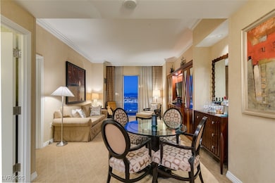 Dining room featuring ornamental molding and baseboards