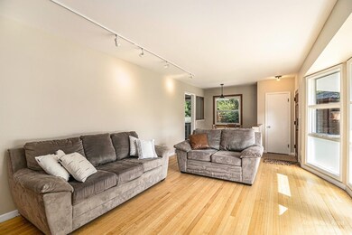 Living room with bay windows.
