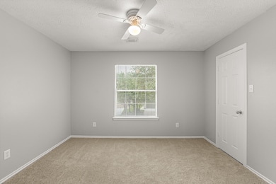 Upstairs features brand new carpet and fresh paint.  This front bedroom features a large walk in closet.