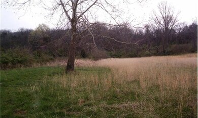 Rolling land, surrounded by other beautiful homes.  Country lifestyle close to all the conveniences.