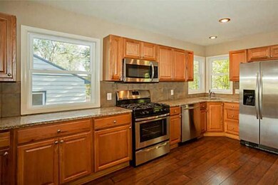 Kitchen. Note the beautiful windows and recessed l