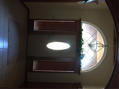 Grand entry area with high ceilings