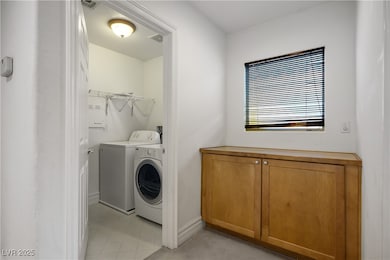 Laundry area with washer and clothes dryer