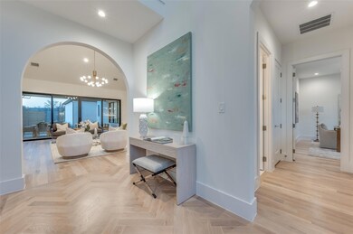 Entry view into living and to guest suite or offic