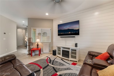 Living area featuring light tile patterned floors,