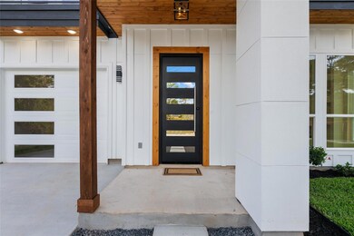 Entrance to property featuring board and batten s