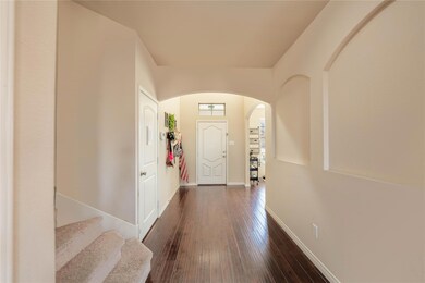 Entryway with dark wood-type flooring