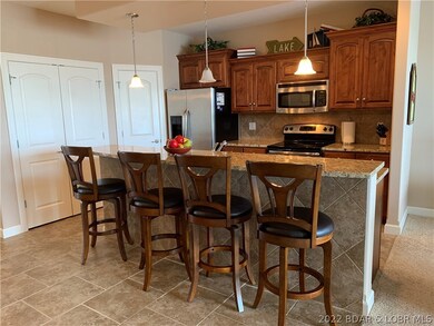 Another view of Bar Area and Kitchen.