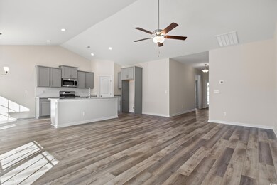 Unfurnished living room with hardwood / wood-style